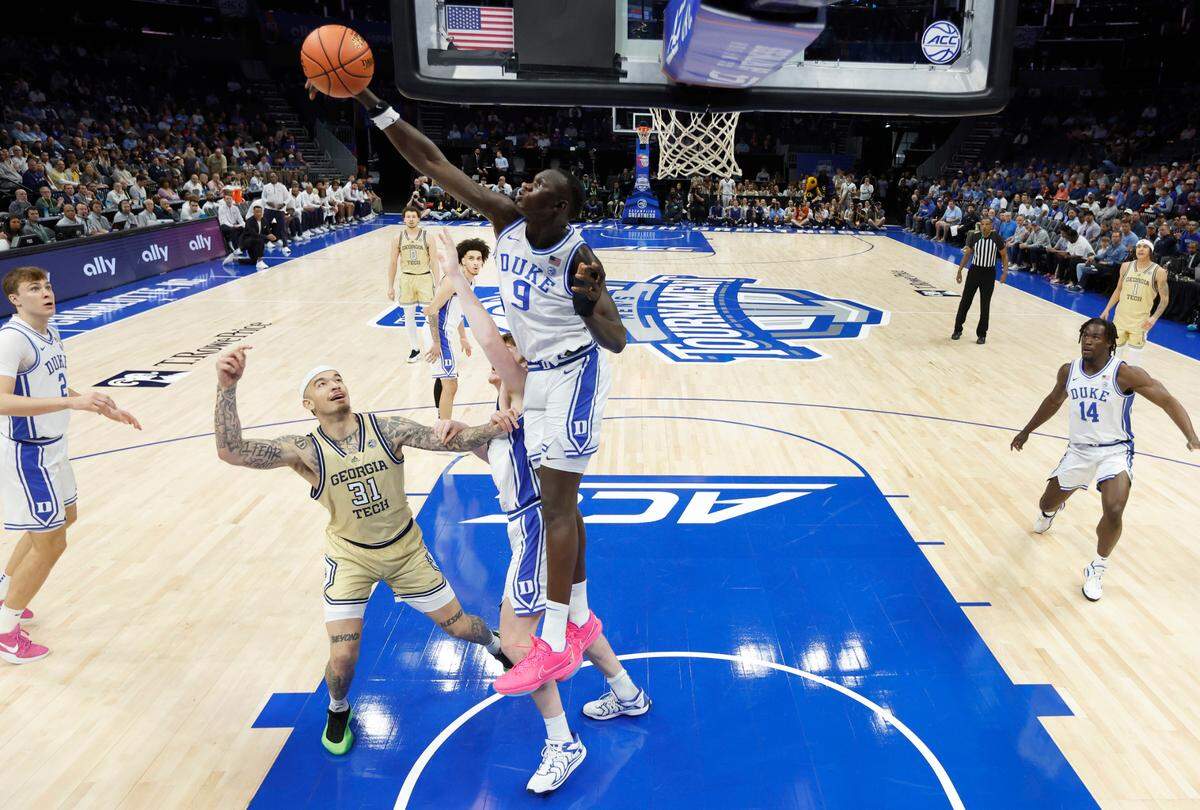Duke’s Khaman Maluach (9) blocks the shot by Georgia Tech’s Duncan Powell (31) during Duke’s victory over Georgia Tech in the quarterfinals of the 2025 ACC Men’s Basketball Tournament at the Spectrum Center in Charlotte, N.C., Thursday, March 13, 2025.