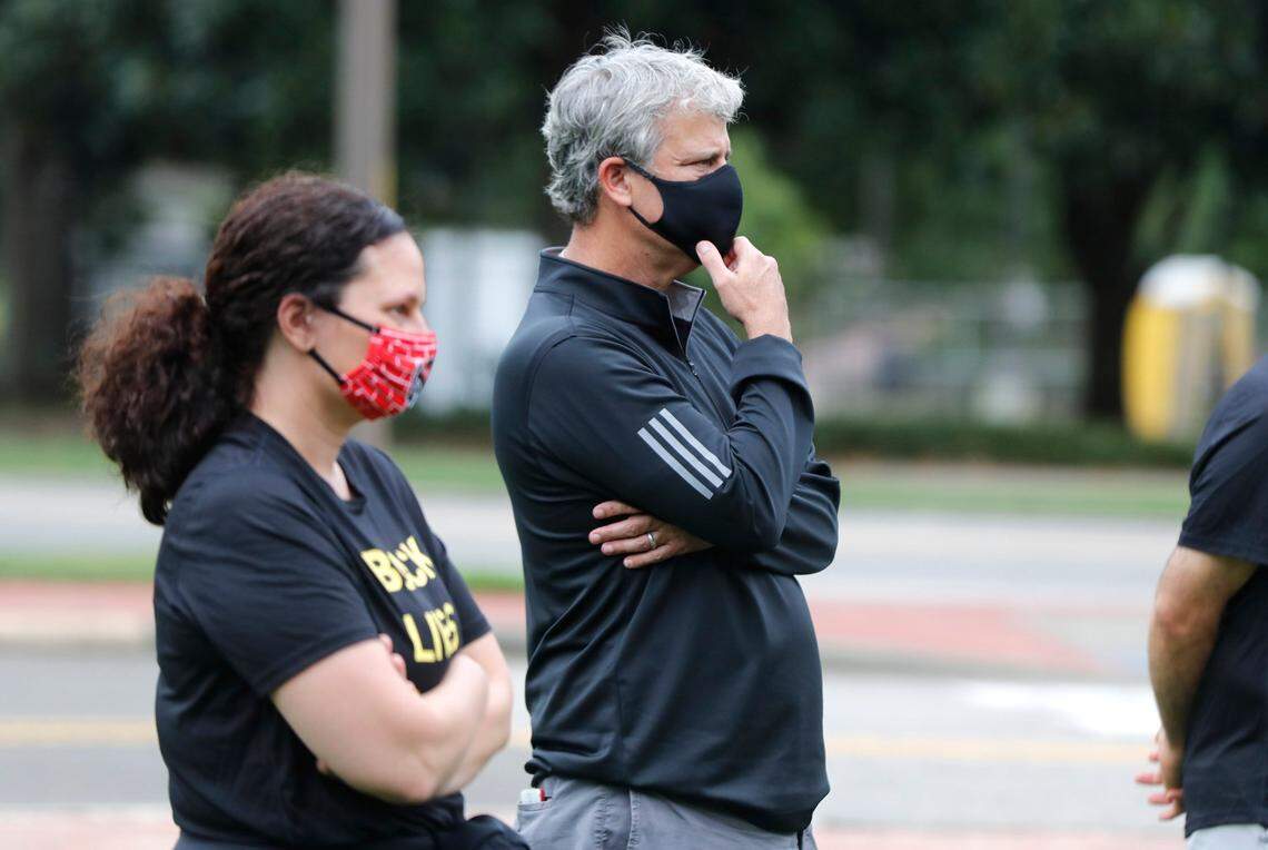 N.C. State Athletics Director Boo Corrigan listens during a #PackUnited peaceful protest against racial and social injustice outside Holladay Hall on the campus of N.C. State Saturday, Sept. 12, 2020.