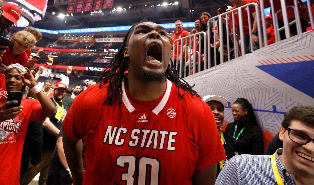 N.C. State’s DJ Burns Jr. (30) celebrates as he leaves the floor after N.C. State’s 84-76 victory over UNC in the championship game of the 2024 ACC Men’s Basketball Tournament at Capital One Arena in Washington, D.C., Saturday, March 16, 2024.