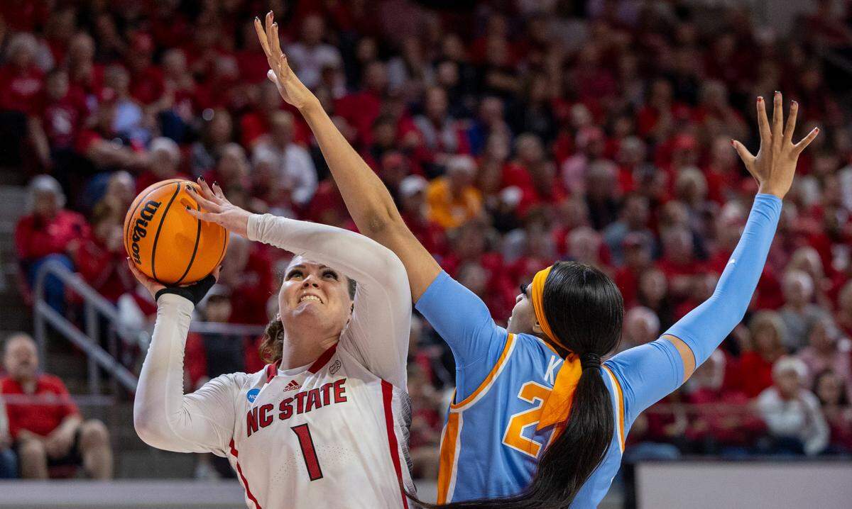 NC State’s River Baldwin (1) shoots as Tennessee’s Tamari Key (20) defends during the second round of the Division I Women’s Basketball Championship at Reynolds Coliseum in Raleigh, on March 25, 2024.