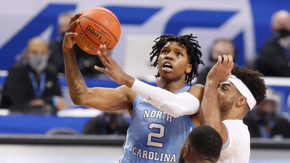 North Carolina’s Caleb Love (2) drives to the basket past Florida State’s Anthony Polite (2) during the first half of UNCs game against Florida State in the seminfinals of the ACC Mens Basketball Tournament in Greensboro, N.C., Friday, March 12, 2021.