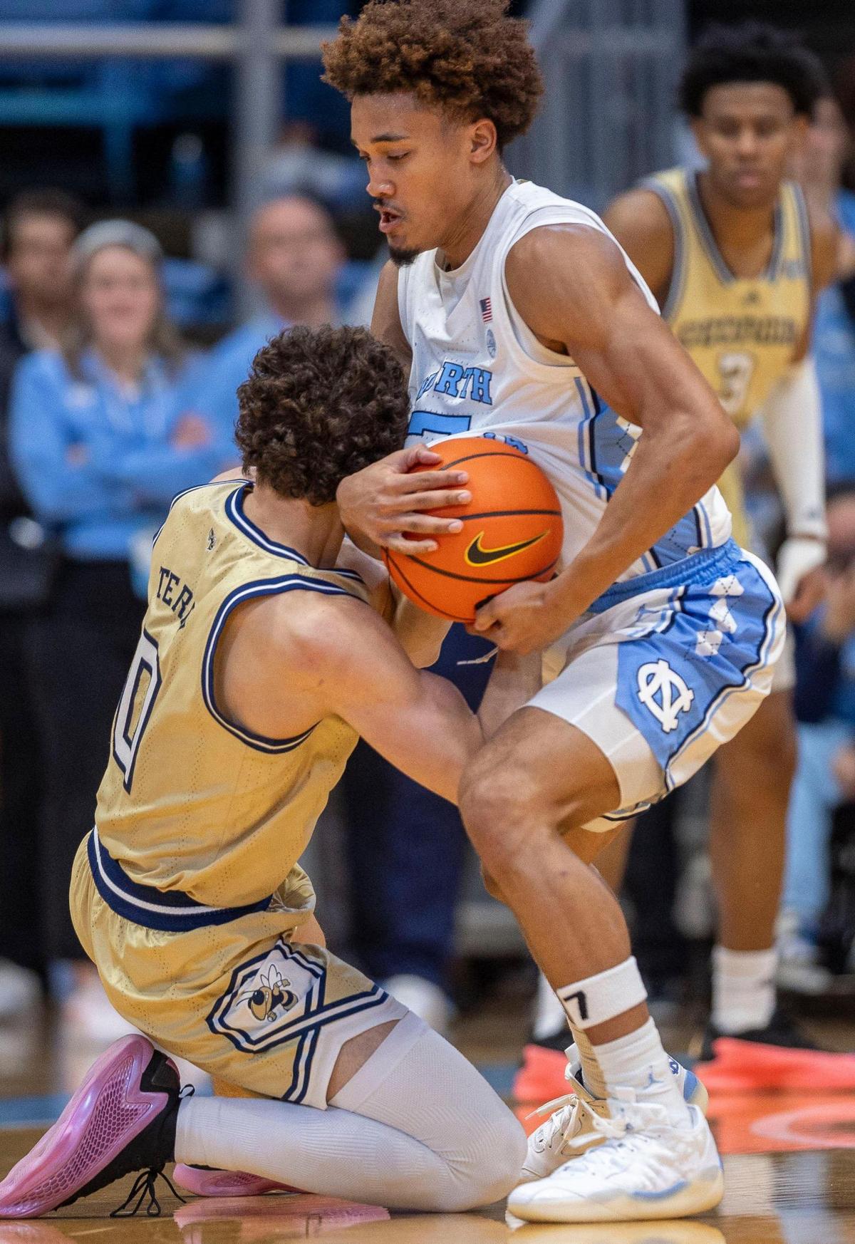 North Carolina guard Seth Trimble (7) makes a steal from Georgia Tech forward Lance Terry (0) in the first half on Saturday, December 7, 2024 at the Smith Center in Chapel Hill, N.C.