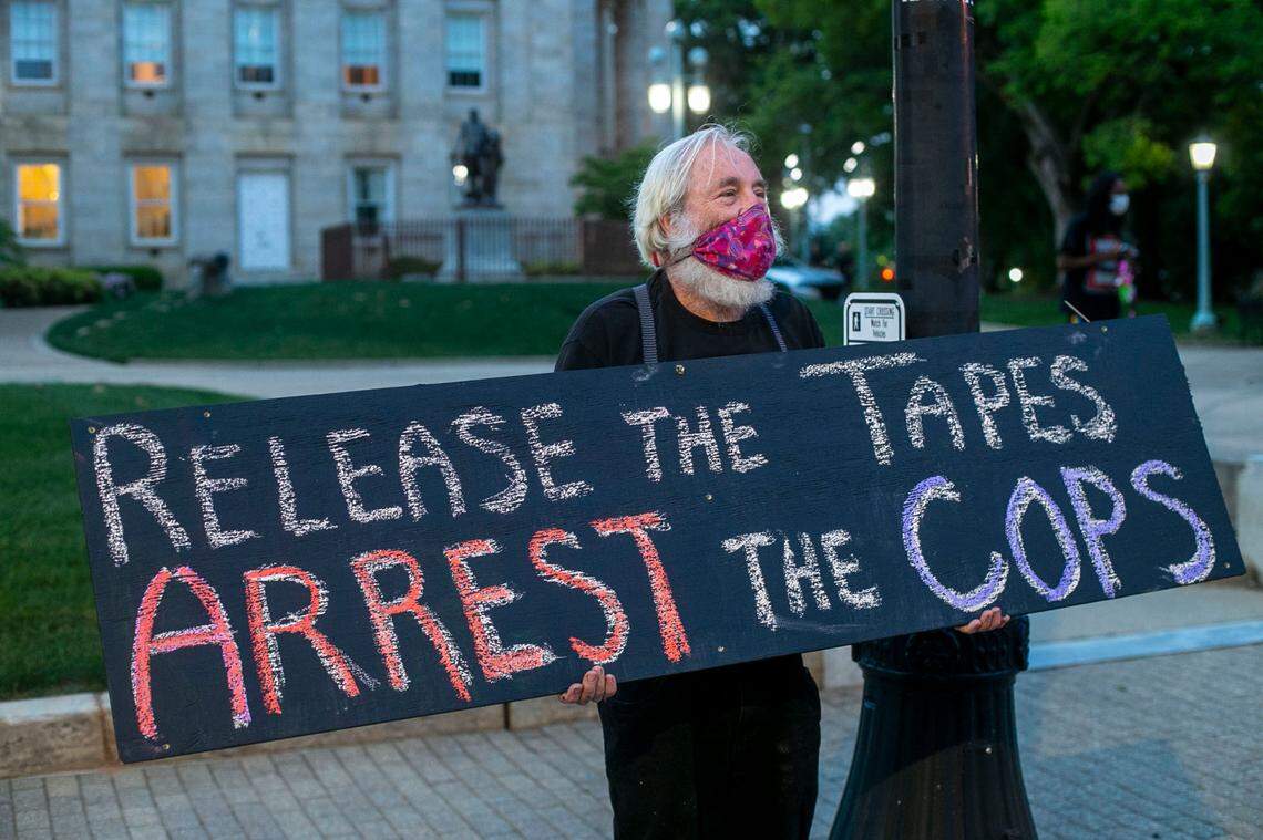 David Freeman of Pittsboro, N.C. was among a group of nearly 20 demonstrators who gathered in front of the State Capitol on Tuesday, May 18, 2021 in Raleigh, N.C., calling for justice in the Andrew Brown Jr. case.