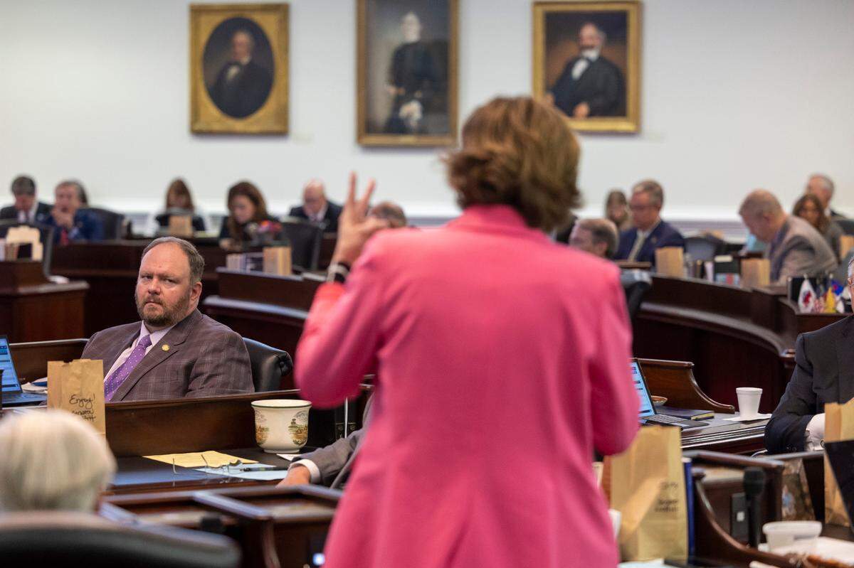 Republican Senator Ralph Hise listens to Democratic Senator Natasha Marcus of Mecklenburg County as she makes an emboldened plea to fellow Senators to save her district during debate of Senate Bill 758, which redraws the North Carolina Senate districts on Tuesday, October 24, 2023 at the General Assembly in Raleigh, N.C.