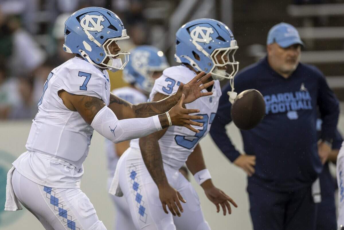 North Carolina quarterback Gio Lopez (7) warms up for the Tar Heels’ game against the University of North Carolina at Charlotte on Saturday, September 6, 2025 at Jerry Richardson Stadium in Charlotte, N.C.