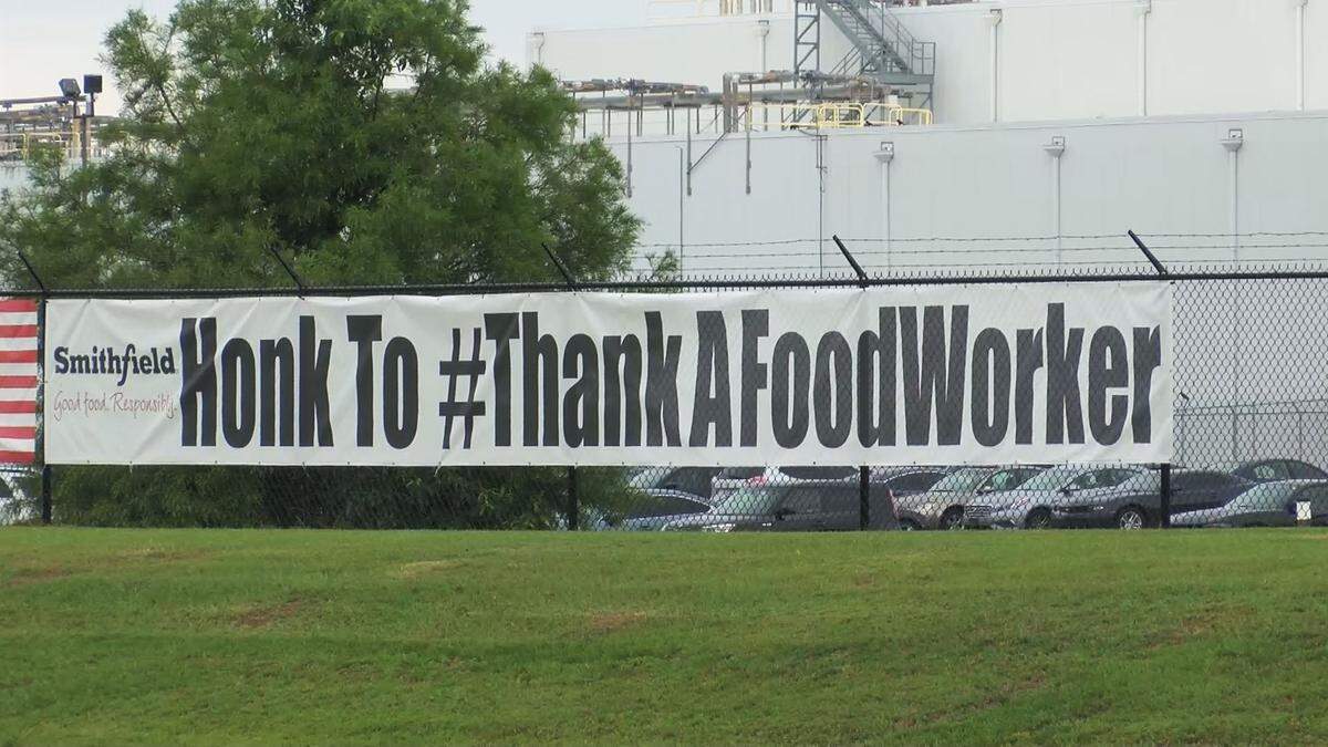 A banner outside the Smithfield Foods plant in Tar Heel on May 26, 2020.
