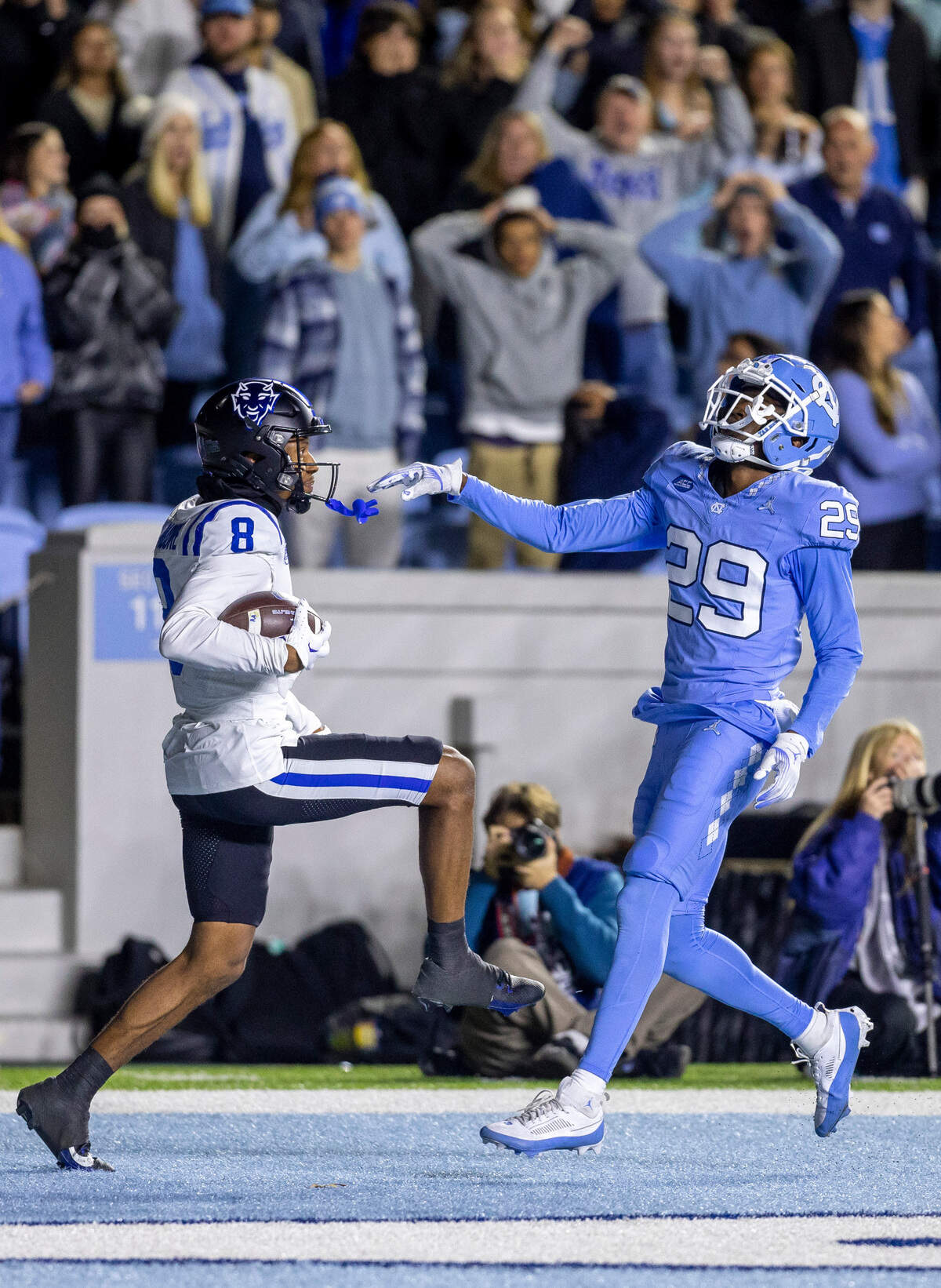 Duke’s Jordan Moore (8) scores a touchdown on a 30-yard reception from quarterback Grayson Loftis ahead North Carolina’s Marcus Allen (29) to take a 36-33 lead with 41 seconds to play in the game on Saturday, Nov. 11, 2023 at Kenan Stadium in Chapel Hill, N.C.