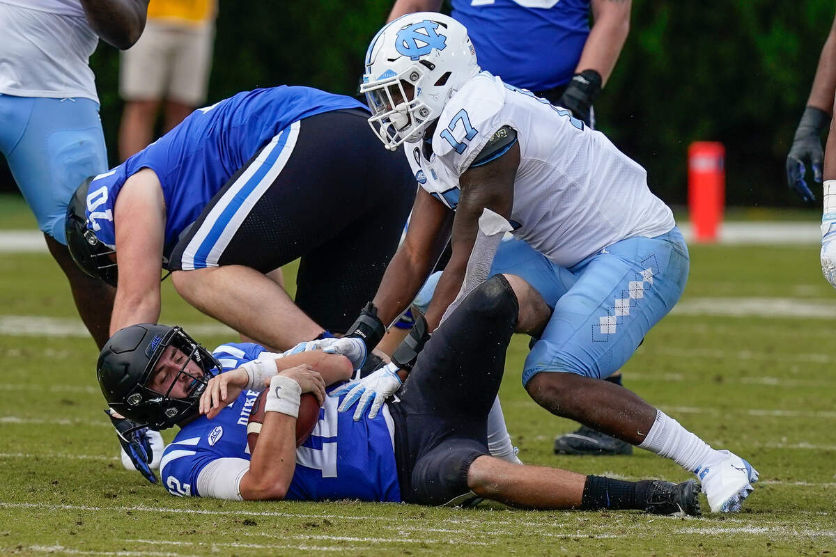 North Carolina Tar Heels linebacker Chris Collins (17) sacks Duke Blue Devils quarterback Gunnar Holmberg (12) during the second half at Wallace Wade Stadium. 