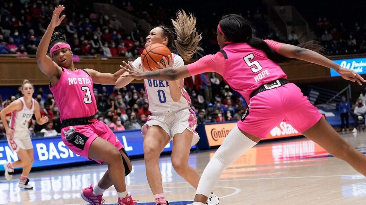 North Carolina State guard Kai Crutchfield (3) and forward Jada Boyd (5) guard against Duke guard Celeste Taylor (0) during the second half of an NCAA college basketball game in Durham, N.C., Sunday, Feb. 13, 2022. (AP Photo/Gerry Broome)