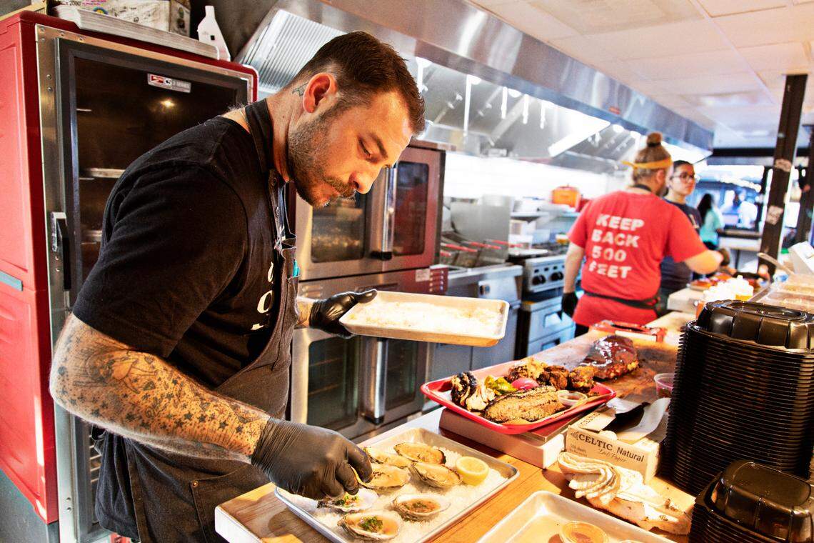 Chef Jake Wood in the kitchen at his restaurant, Lawrence BBQ, located in the new Boxyard RTP on Friday, Dec. 3, 2021.