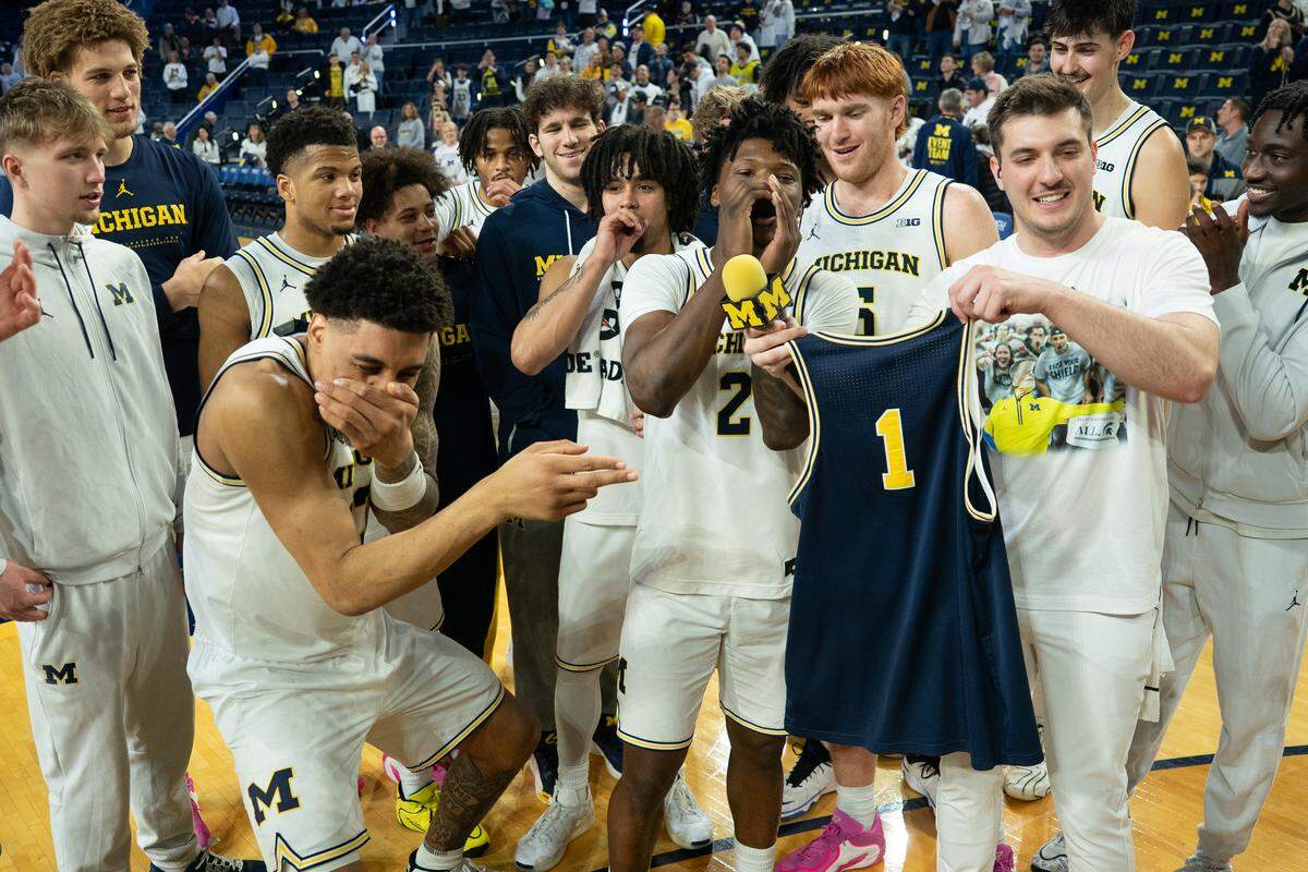 The Michigan Wolverines celebrate during a postgame interview following the Wolverines’ 86-56 victory against the UCLA Bruins at Crisler Arena on Feb. 14, 2026 in Ann Arbor, Michigan.