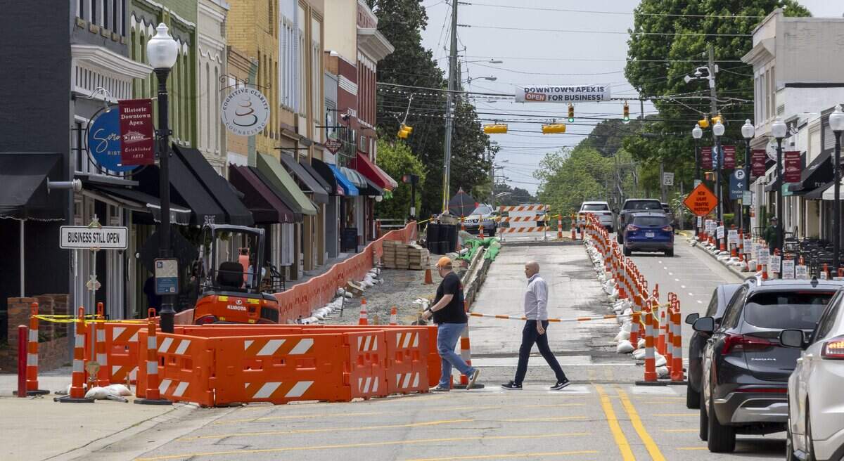 Pedestrians cross Salem Street on Tuesday, April 28, 2026 in Apex, N.C. The Salem Streetscape project, which began in January, was originally slated to be completed by October 2026.