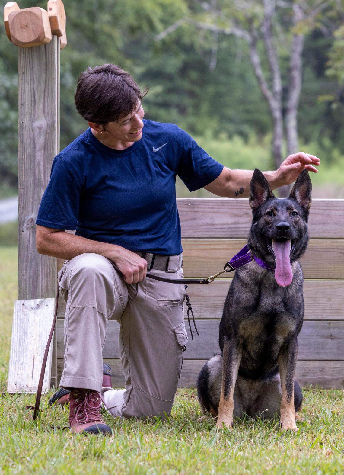 Lori McLamb trains with Charlie, a sable German shepherd that was surrendered to the Orange County animal shelter in late March.