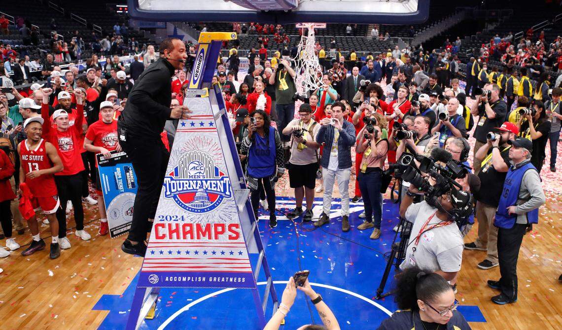 N.C. State head coach Kevin Keatts heads up the ladder to cut down the net after N.C. State’s 84-76 victory over UNC in the championship game of the 2024 ACC Men’s Basketball Tournament at Capital One Arena in Washington, D.C., Saturday, March 16, 2024.