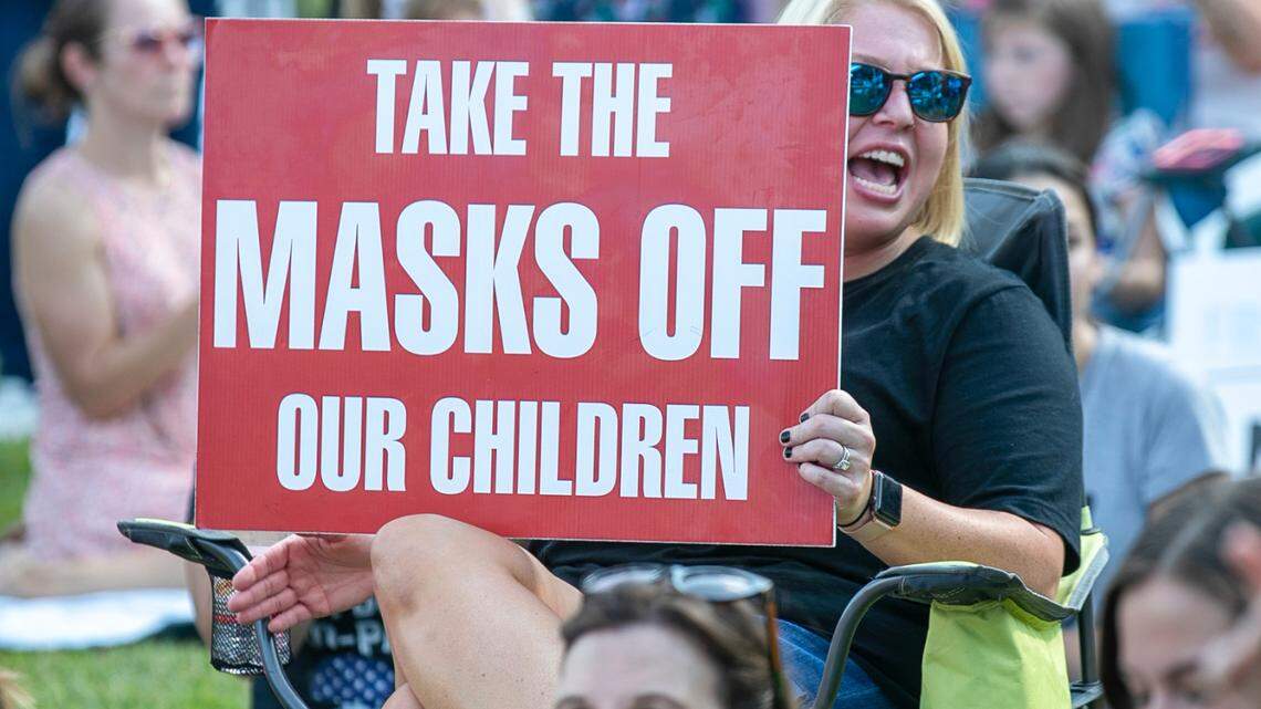 Demonstrators opposing a mask mandate gather outside the Johnston County Board of Education meeting on Tuesday, September 14, 2021 in Smithfield, N.C. Some North Carolina school districts are now dropping face mask mandates for the first time since the start of the COVID-19 pandemic nearly two years ago.