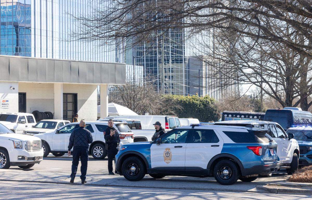 Raleigh Police surround the N. Hills Exxon on Lassiter Mill Road, as they investigate a possible shooting on Friday, January 17, 2025 in Raleigh, N.C.