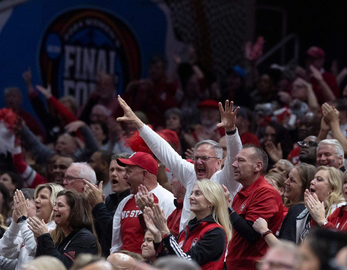 N.C. State fans cheer during the first half of the Wolfpack’s 78-59 Final Four loss to South Carolina at Rocket Mortgage FieldHouse on Friday, April 5, 2024, in Cleveland, Ohio.
