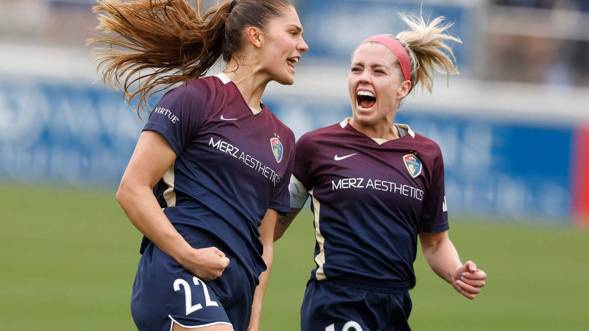 North Carolina midfielder Denise O’Sullivan (10), right, celebrates with forward Mille Gejl (22) after Geil scored during the first half of the Courage’s game against Kansas City at WakeMed Soccer Park in Cary, N.C., Saturday, March 25, 2023.
