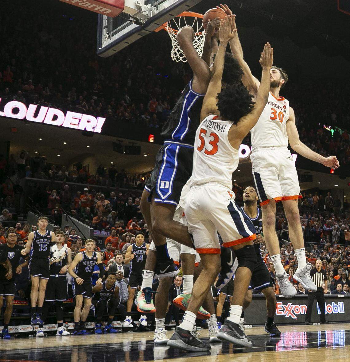 Virginia’s Jay Huff (30) blocks a shot attempt by Duke’s Vernon Carey Jr. (1) with five seconds to play to help secure the Cavaliers 52-50 victory over Duke on Saturday, February 29, 2020 at John Paul Jones Arena in Charlottesville, Va.