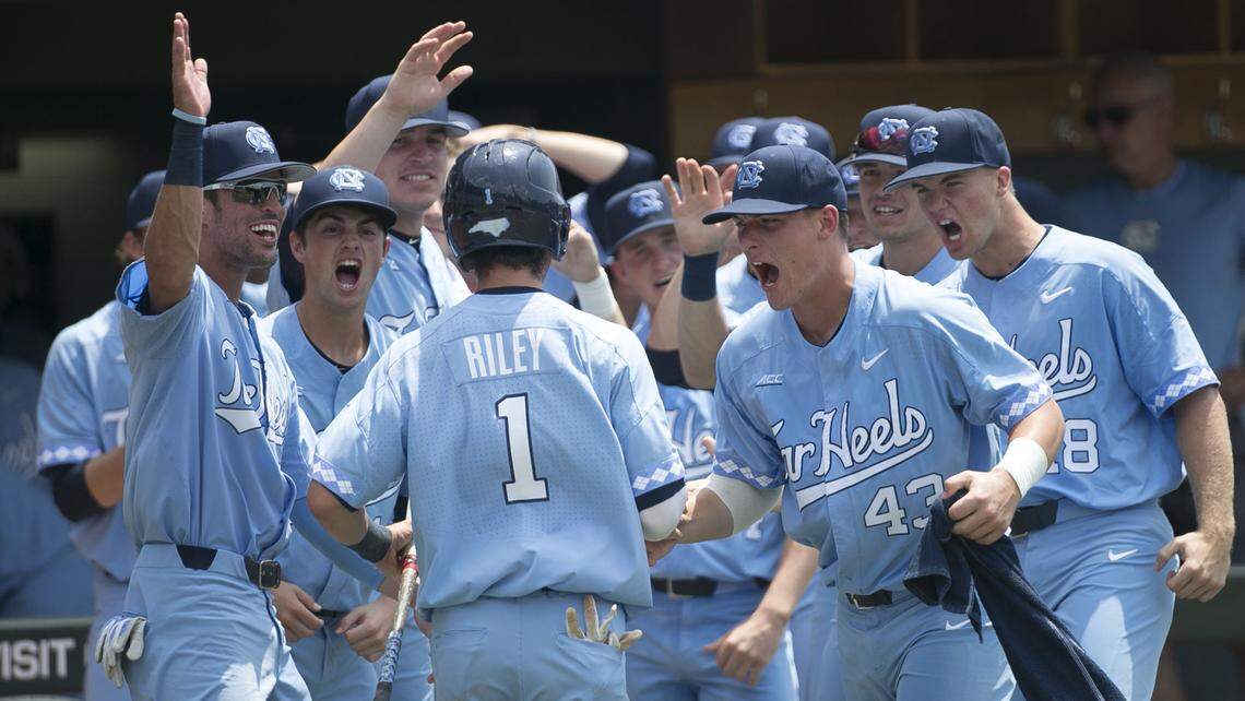 North Carolina’s Brandon Riley (1) is welcomed to the dugout after scoring on a single by Zack Gahagann in the first inning against Stetson during the NCAA Super Regional on Saturday, June 9, 2018 at Boshamer Stadium in Chapel Hill, N.C.