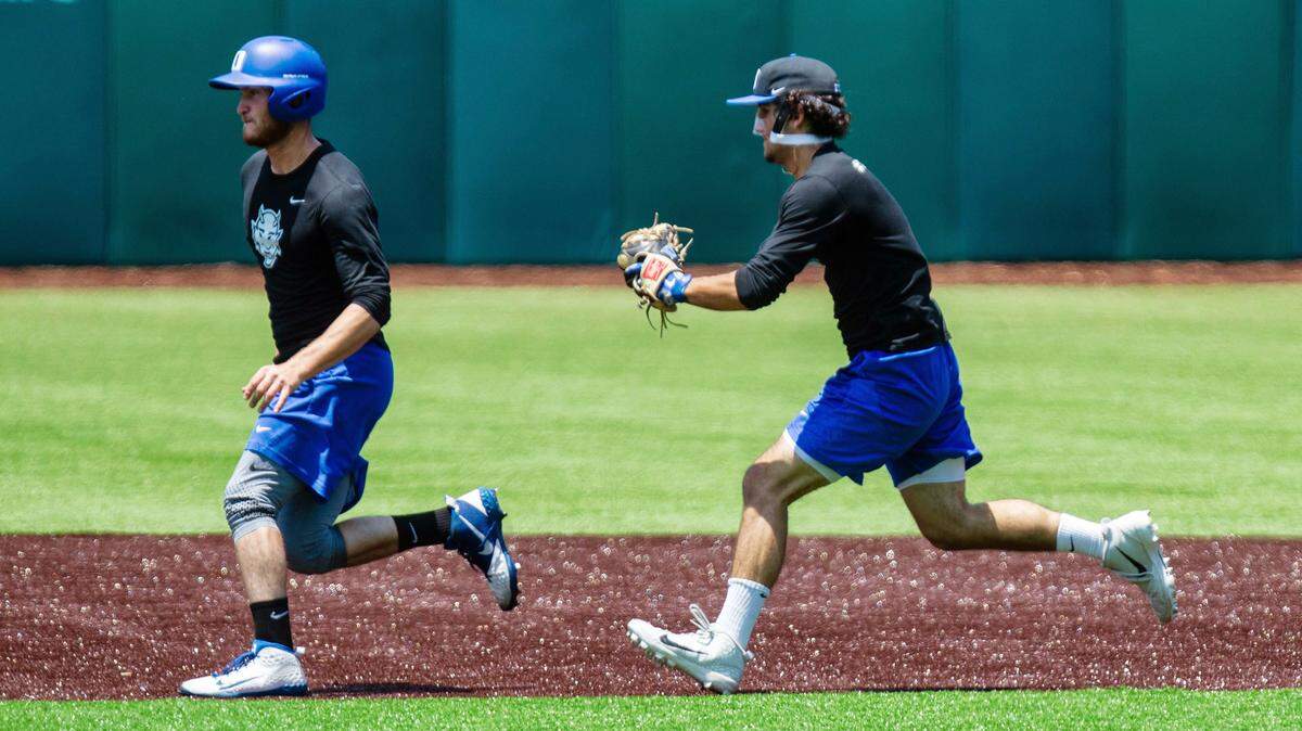 Duke shortstop Ethan Murray, right, gets ready to tag a runner during practice Tuesday, June 4, 2019 at Jack Coombs Field at Duke University in Durham. Duke is preparing for the Nashville Super Regional at Hawkins Field at Vanderbilt.