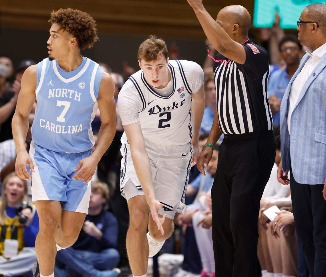 Duke’s Cooper Flagg (2) celebrates hitting a three-pointer during the first half of Duke’s game against UNC at Cameron Indoor Stadium in Durham, N.C., Saturday, Feb. 1, 2025. North Carolina’s Seth Trimble (7) is to the left.