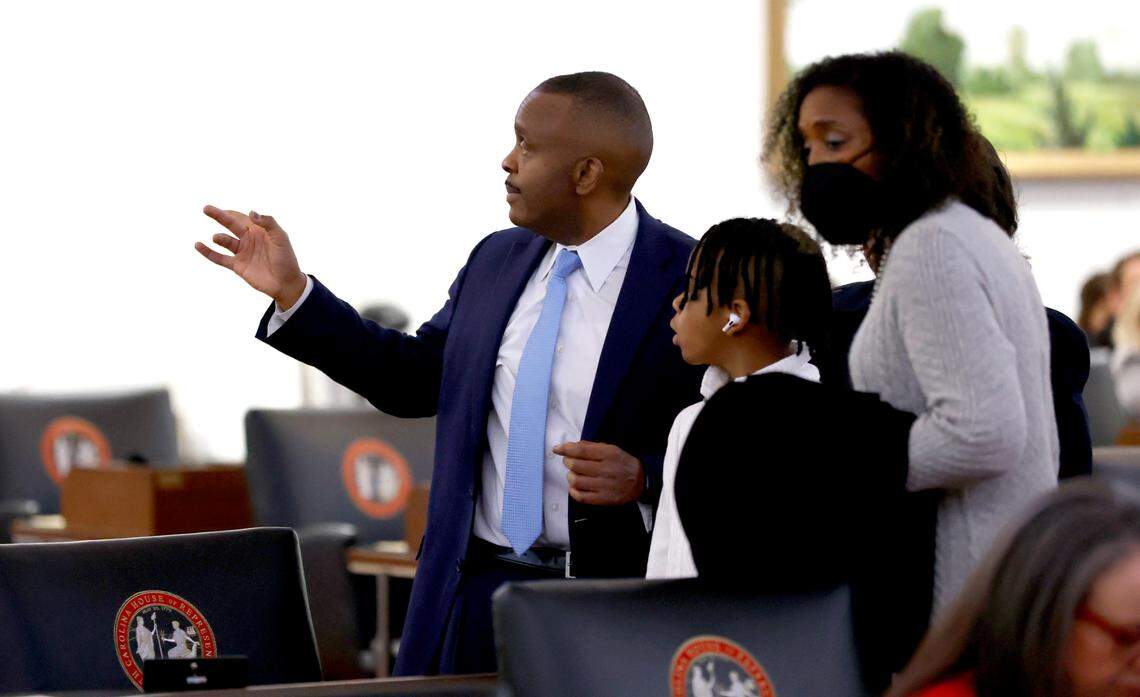 House Democratic Leader Robert Reives walks on the floor with family members before the opening session of the N.C. House of Representatives Wednesday, Jan. 11, 2023.
