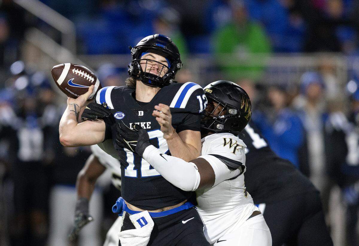 Duke’s Grayson Loftis is sacked by Wake Forest’s Bryce Ganious during the first half of the Blue Devils’ game on Thursday, Nov. 2, 2023, at Wallace Wade Stadium in Durham, N.C.