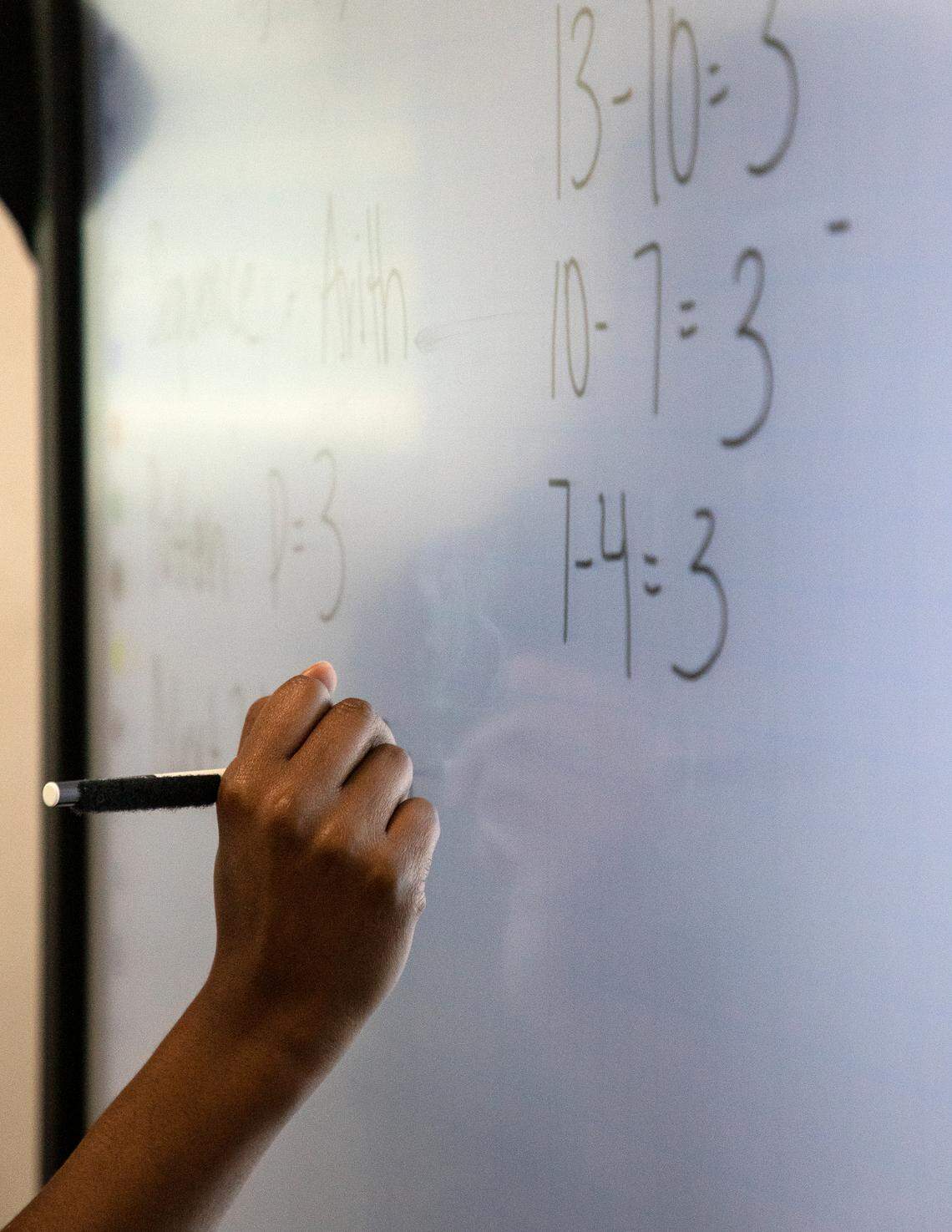 Knightdale High School teacher Alex Johnson explains examples of sequences during a math class on Tuesday, Sept. 5, 2023, in Knightdale, N.C.
