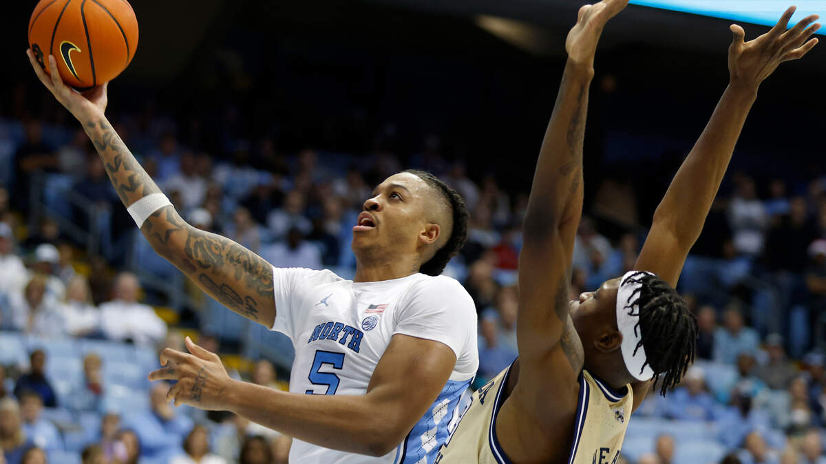North Carolina’s Armando Bacot drives to the basket past Georgia Tech’s Jordan Meka during the second half of a men’s basketball game at the Dean E. Smith Center on Saturday, Dec. 10, 2022, in Chapel Hill, N.C.