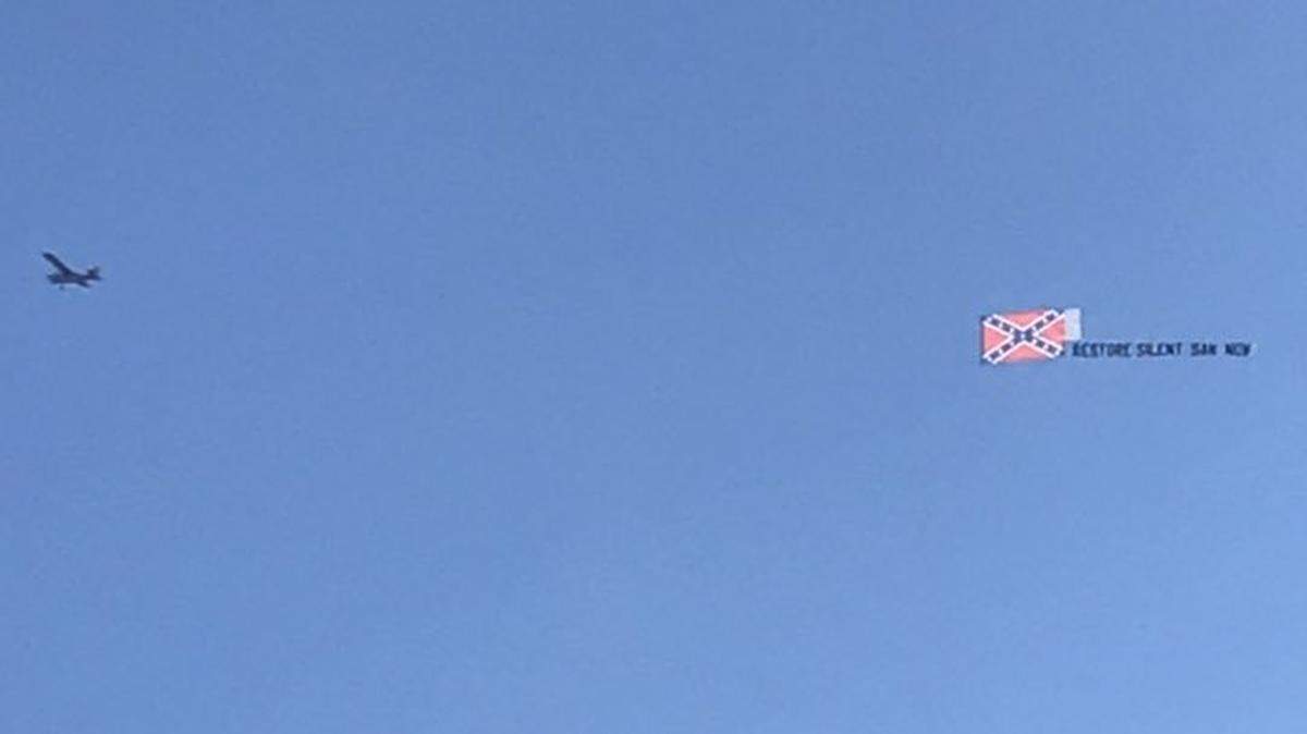 A plane towing a Confederate flag and a banner that reads “Restore Silent Sam Now” was spotted flying over Chapel Hill on Sunday, Nov. 11, 2018.