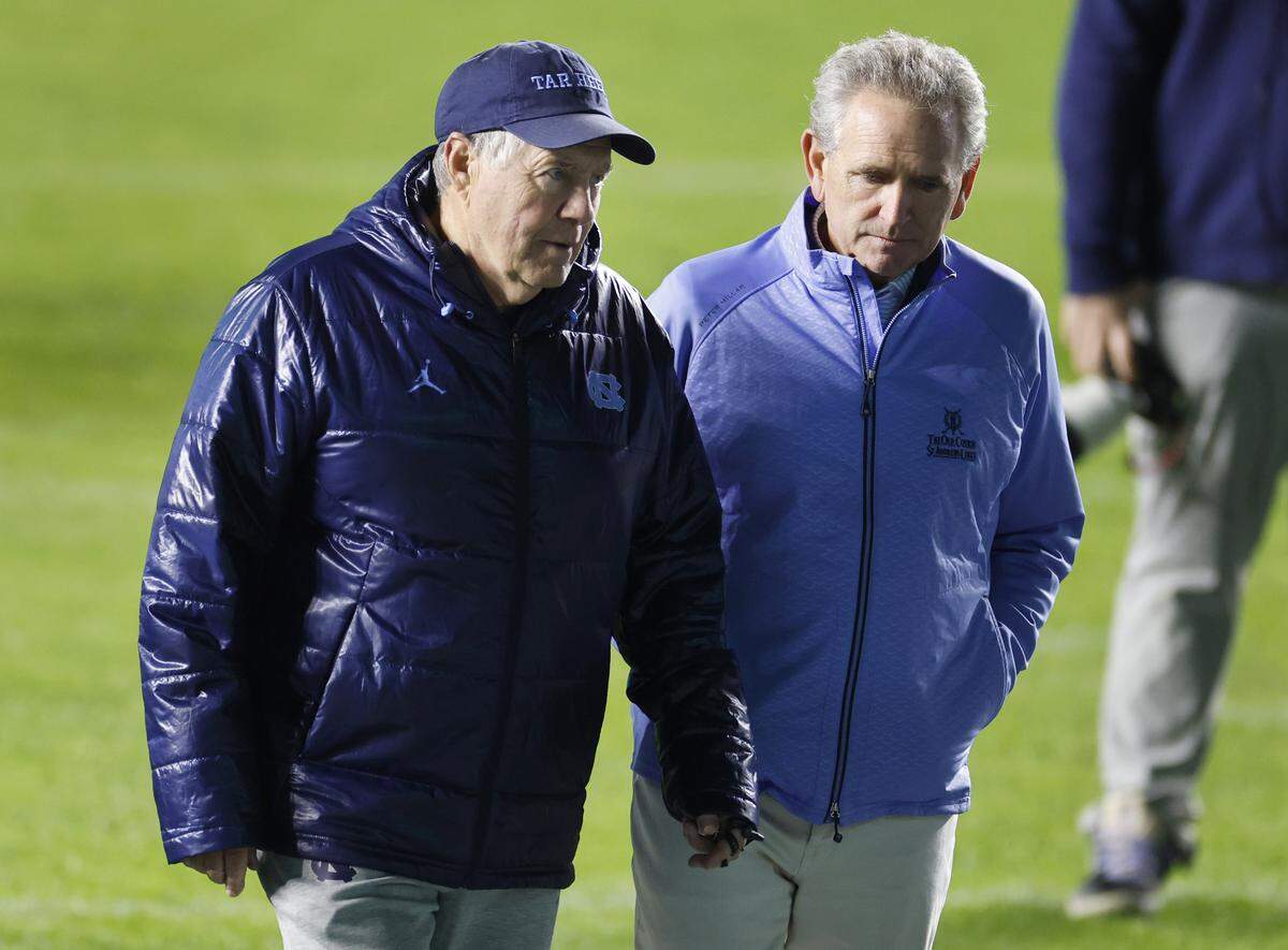 North Carolina head football coach Bill Belichick talks with athletic director Bubba Cunningham after UNC football’s Practice Like a Pro open practice at Kenan Stadium in Chapel Hill, N.C., Saturday, April 12, 2025.