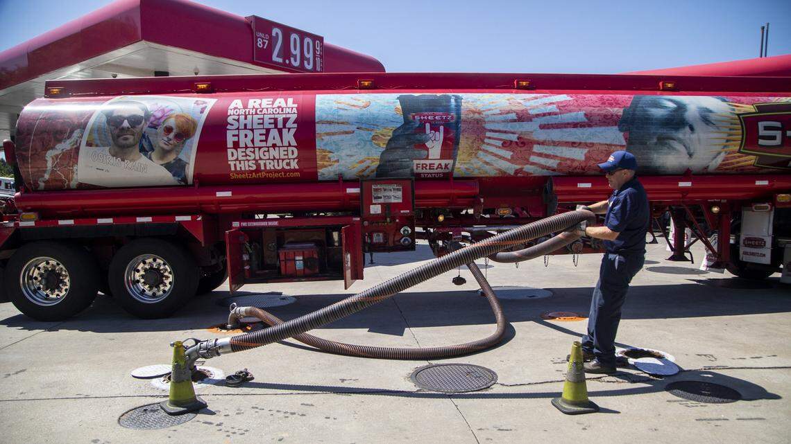 A fuel tanker driver delivers a 9000 gallon load of fuel at the Sheetz on New Bern Avenue in Raleigh Thursday, May 13, 2021. Operators of the Colonial Pipeline say they began the process of moving fuel through the 5,500-mile pipeline again at about 5 p.m. Wednesday, six days after it was shut down because of a cyberattack.