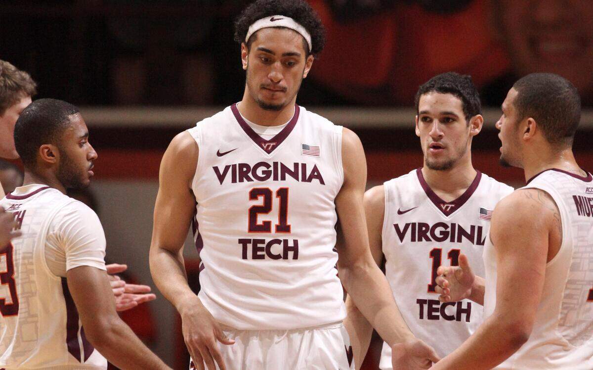 Virginia Tech's Satchel Pierce is surrounded by his teammates during the first half of an NCAA college basketball game against Boston College in Blacksburg, Va., Monday, March 2, 2015. 