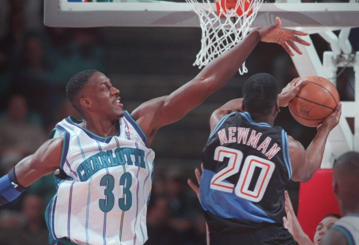2/10/99 Charlotte’s Charles Shackleford (33) creates a roadblock for Cleveland’s Johnny Newman (20) as he drives to the basket.