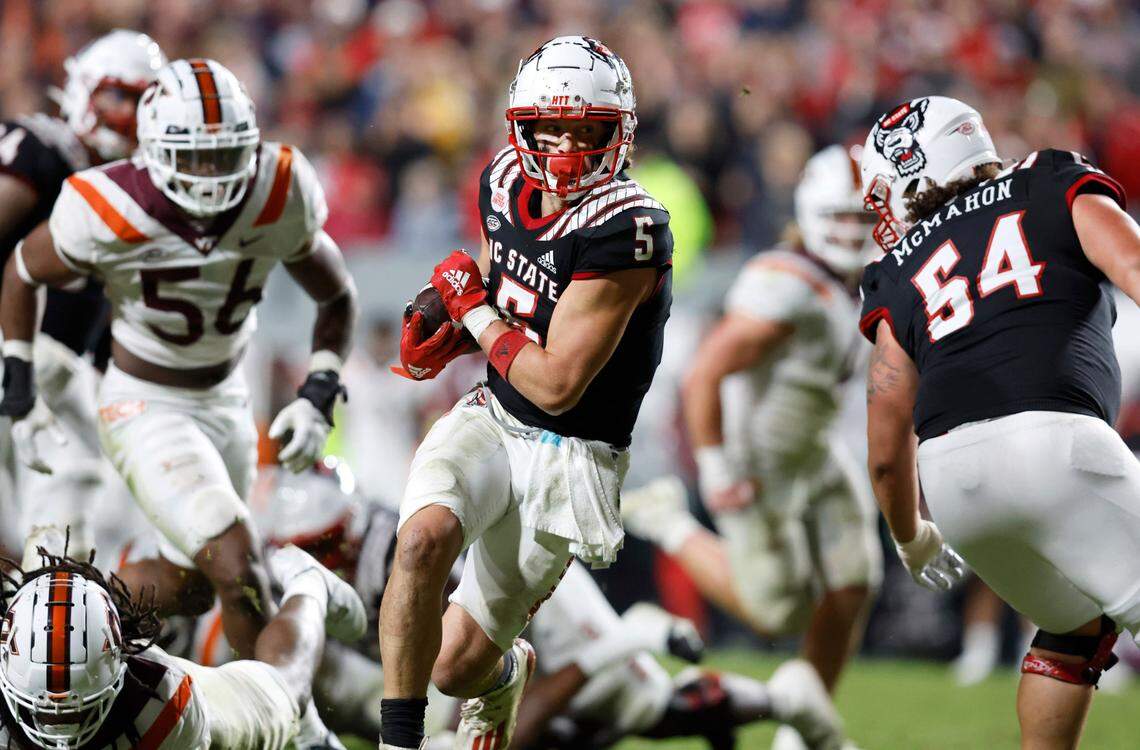 N.C. State wide receiver Thayer Thomas (5) heads to the end zone while scoring on a 18-yard touchdown reception during the second half of N.C. State’s 22-21 victory over Virginia Tech at Carter-Finley Stadium in Raleigh, N.C., Thursday, Oct. 27, 2022.