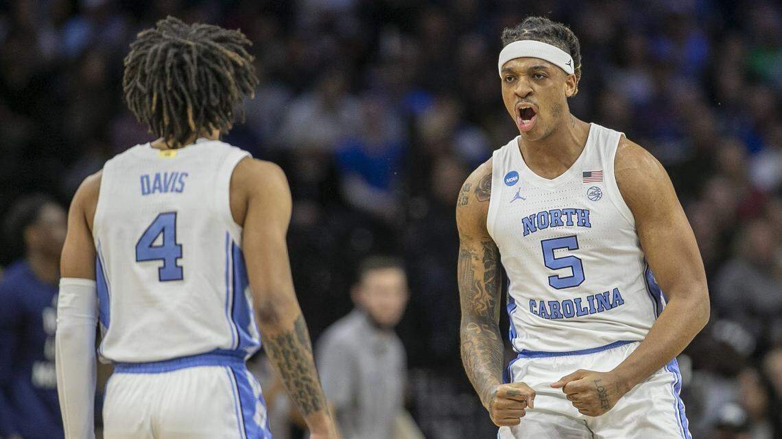 North Carolinas Armando Bacot (5) and R.J. Davis (4) react after securing a lead over Saint Peters in the first half during the NCAA East Regional final on Sunday, March 27, 2022 at Wells Fargo Center in Philadelphia, Pa.