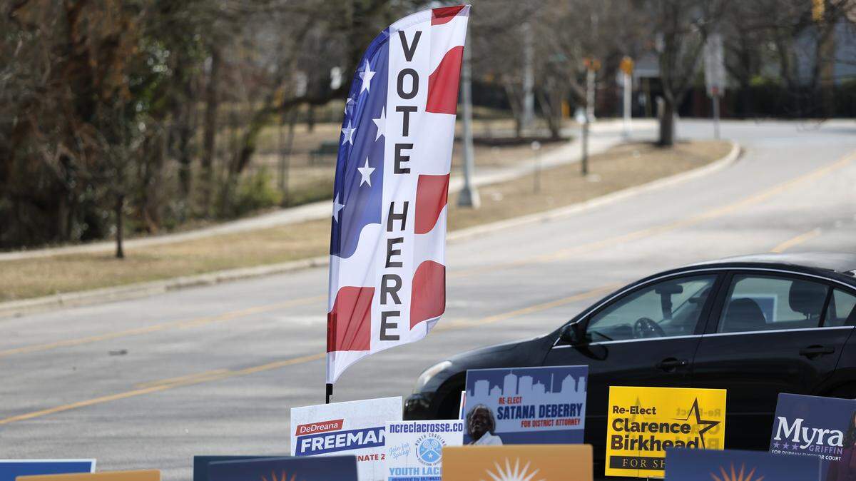 Voting signs direct people to the early voting site at the Durham County Main Library in Durham, N.C., Thursday, Feb. 12, 2026.