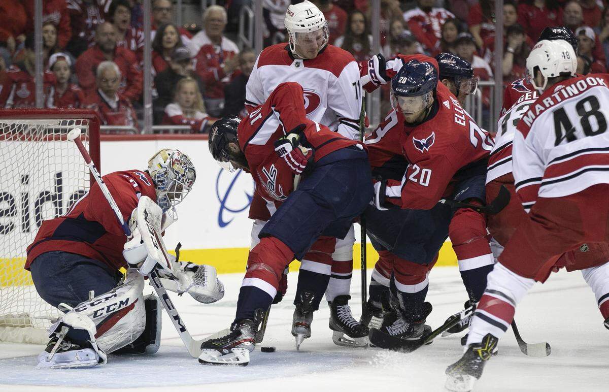 Washington Capitals’ Brett Connolly (10) denies Carolina Hurricanes’ Lucas Wallmark (71) the puck in front of Capitals’ goalie Braden Holtby (70) in the first period during Game 7 of their first round Stanley Cup series on Wednesday, April 24, 2019 at Capital One Arena in Washington, D.C.