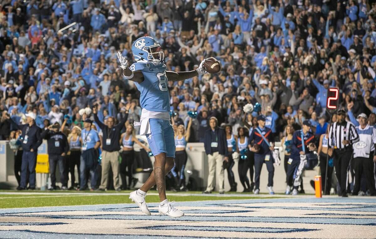 North Carolina wide receiver Kobe Paysour (8) reacts after scoring a touchdown on a one-yard pass from quarterback Drake Maye in the second quarter against Pitt on Saturday, October 29, 2022 at Kenan Stadium in Chapel Hill, N.C.