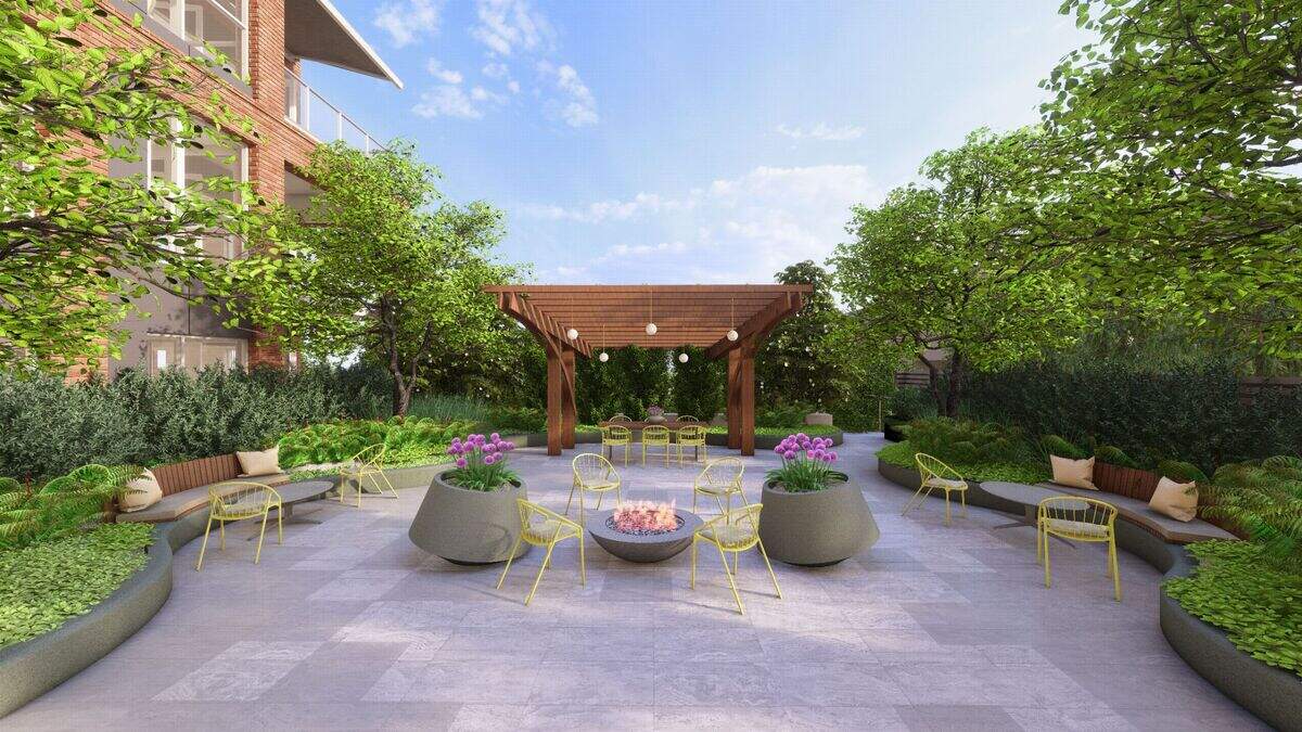A rendering of the outside courtyard at The Lansing, a five-story 53-unit condominium building at 101 Enterprise St., near Gardner Arboretum, in Raleigh.