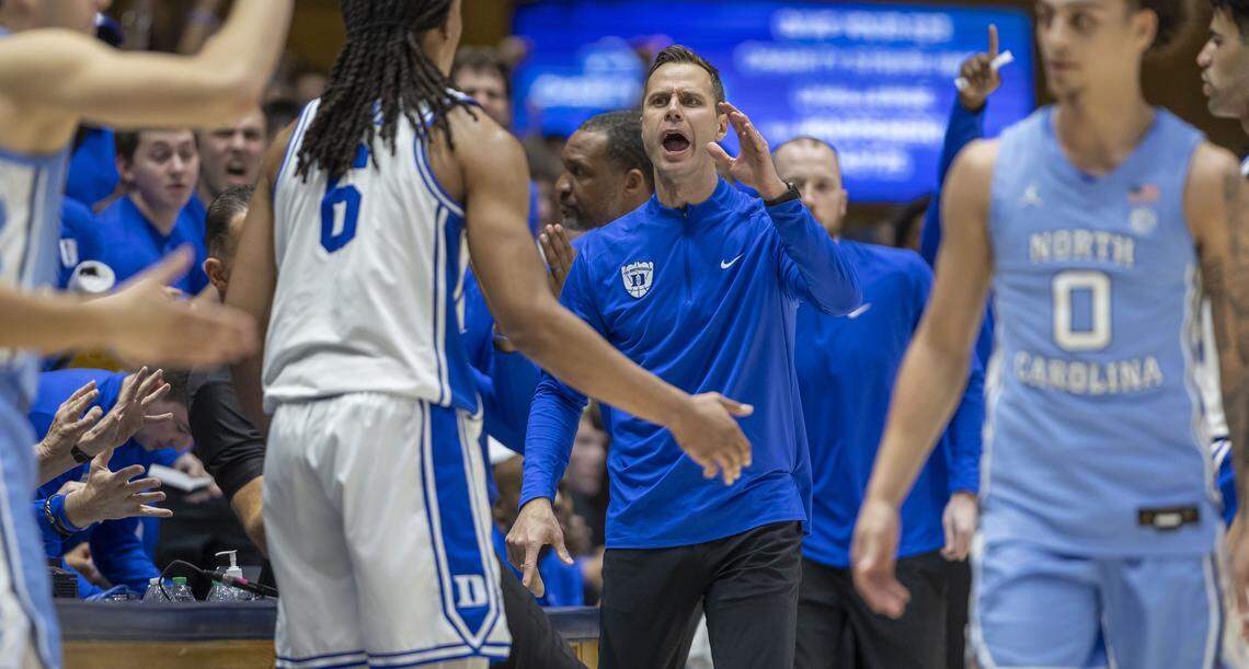 Duke coach Jon Scheyer instructs his players after forcing a turnover by North Carolina in the first half on Saturday, March 7, 2026 at Cameron Indoor Stadium in Durham, N.C.