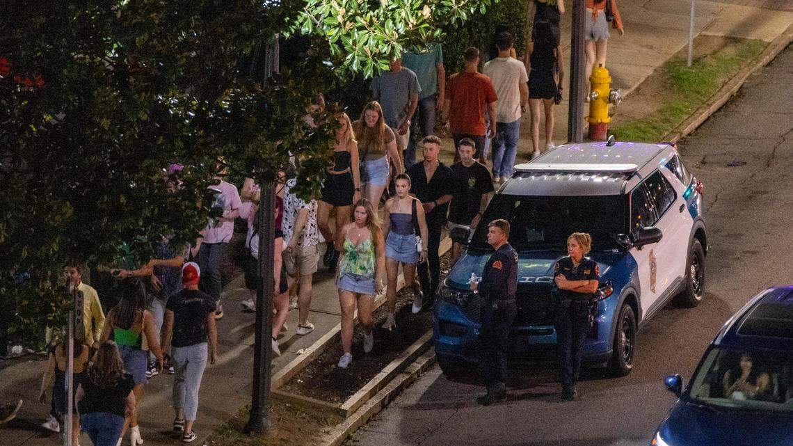 Raleigh Police officers maintain a presence at around 1 a.m. in the Glenwood South district on Friday, July 21, 2023.