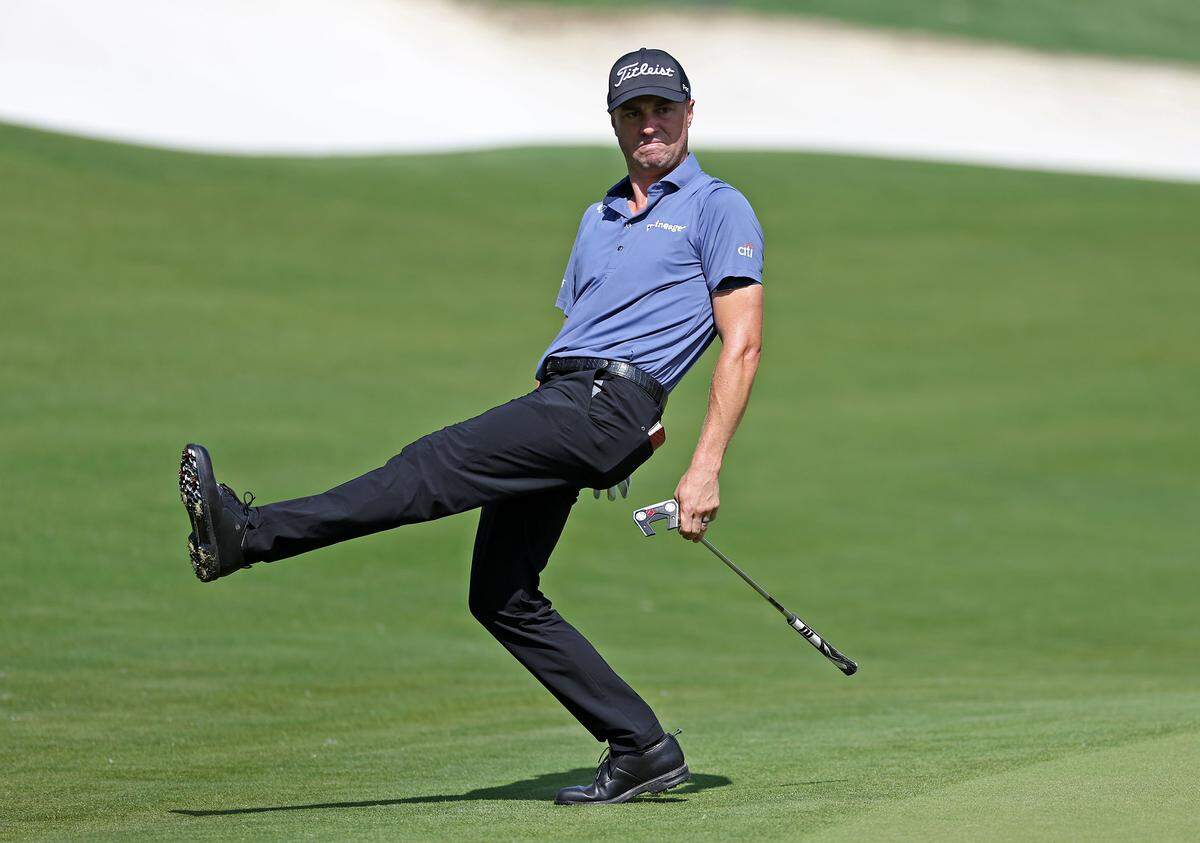 Justin Thomas tries to help his ball toward the cup in 2024 in Charlotte.