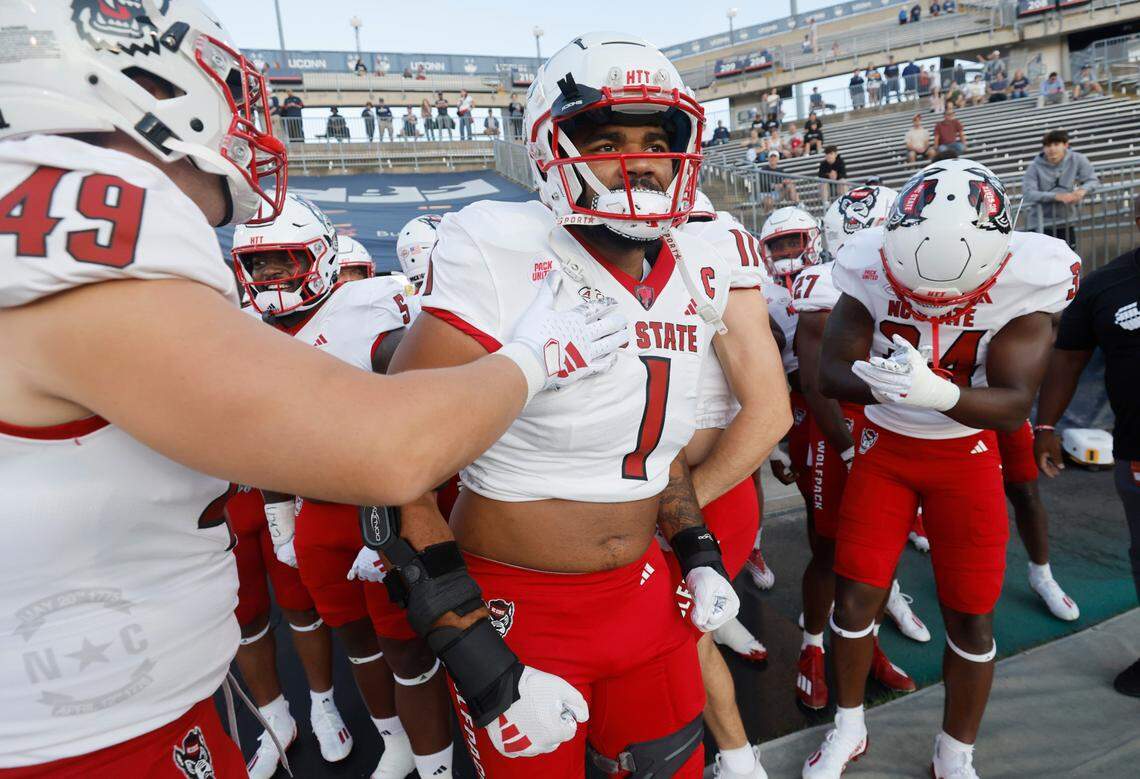 N.C. State defensive tackle Davin Vann (1) gets ready to head out onto the field to warmup before N.C. State’s game against UConn at Rentschler Field in East Hartford, Conn. Thursday, August 31, 2023.