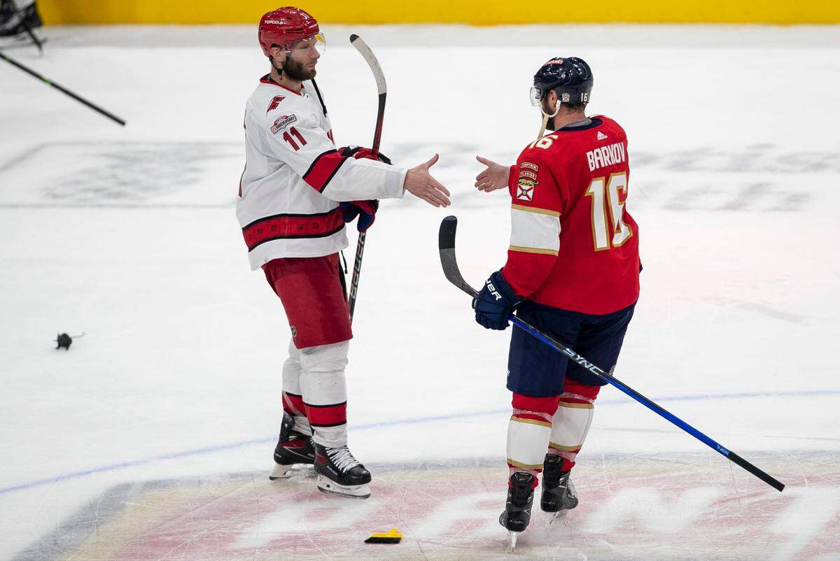 The Carolina Hurricanes Jordan Staal (11) begins the handshake line by congratulating the Florida Panthers Aleksander Barkov (16) following the Panthers’ 4-3 victory, clinching the Eastern Conference Finals, on Wednesday, May 24, 2023 at FLA Live Arena in Sunrise, Fla. 