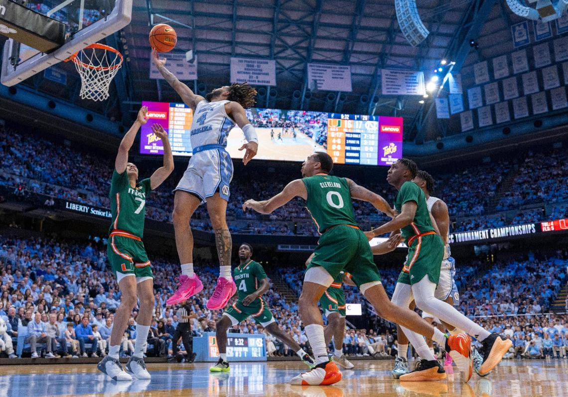 North Carolina’s R.J. Davis (4) drives to the basket against Miami’s Kyshawn George (7) in the first half on Monday, February 26, 2024 at the Smith Center in Chapel Hill, N.C. Davis scored 21 points in the first half.