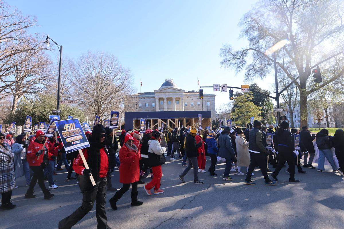 Parade-goers march during the 45th Annual Martin Luther King, Jr. Memorial March in downtown Raleigh on Monday, Jan. 20 ,2025.