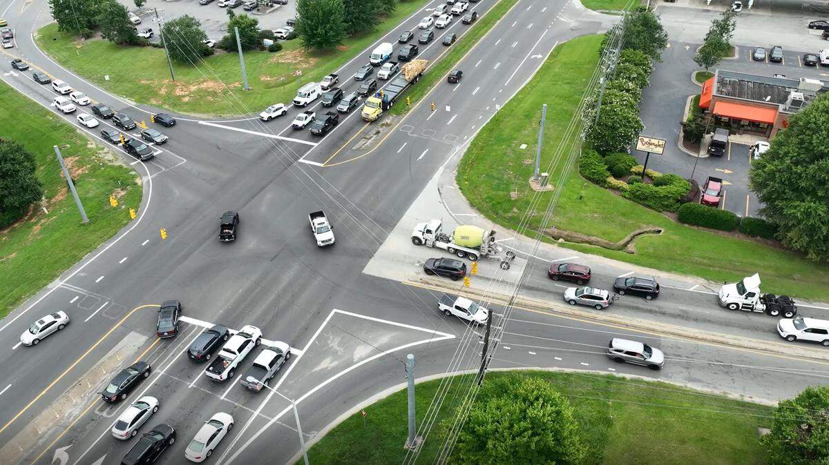 An aerial view of the intersection of U.S. 70 Business and Shotwell Road, looking west. U.S. 70 is the four-lane divided highway.