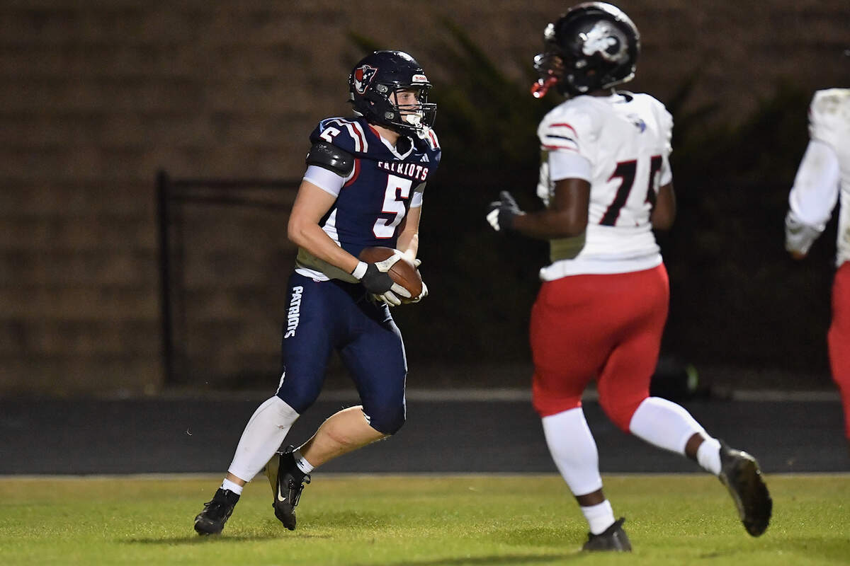 Apex Friendship defensive end Caden Mazur (5) recovers the ball in the end zone off a fumble from Rolesville to score the touchdown. The Apex Friendship Patriots and the Rolesville Rams met in  the second round of the  NCHSAA 8A Playoff game in Apex, N.C. on November 14, 2025. Rolesville wins 14-7 in overtime.